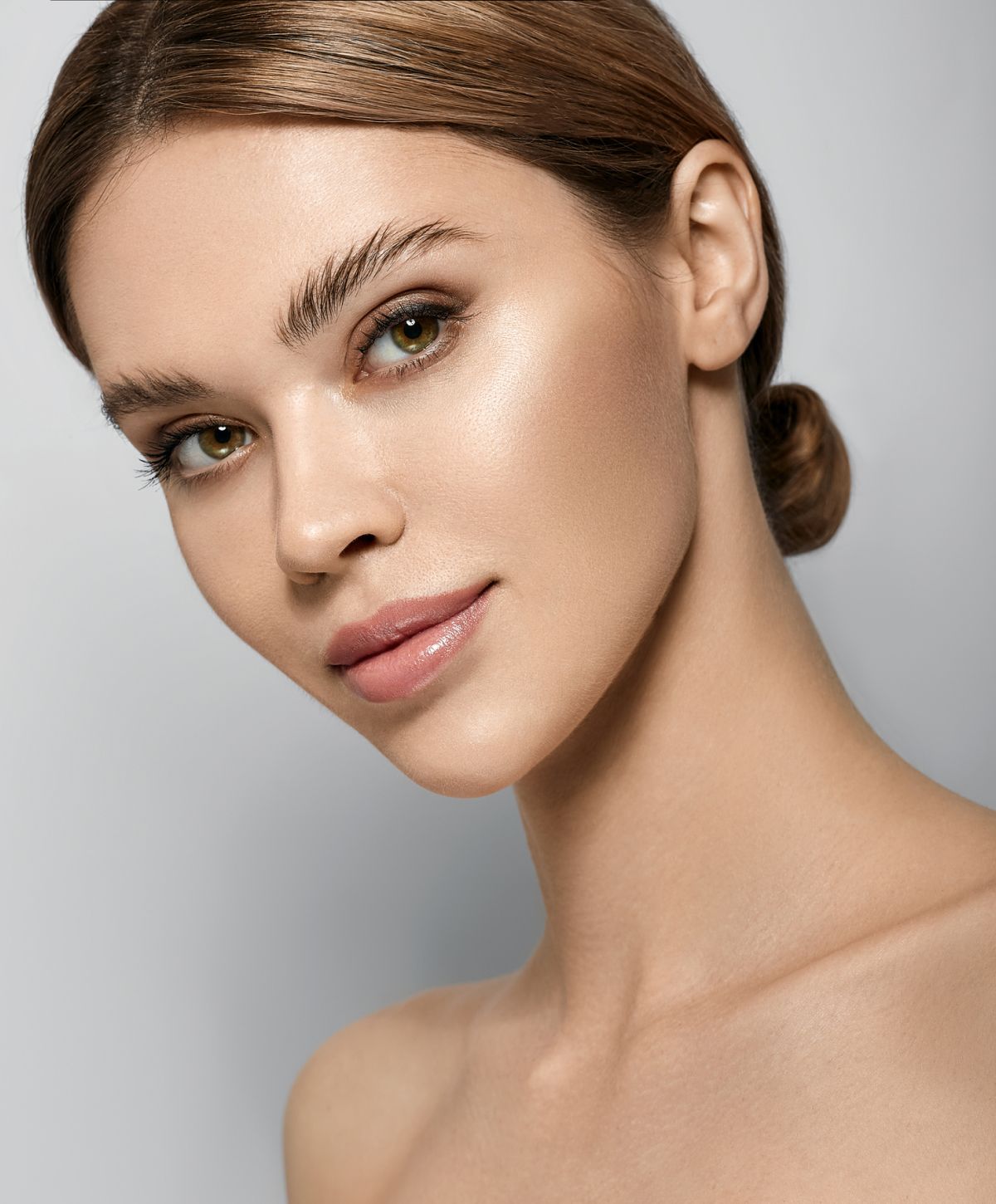 Close-up of woman with natural makeup and hairstyle.